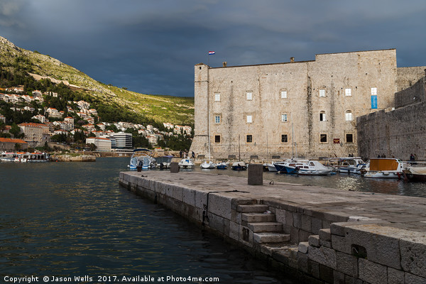 Stormy skies behind St John’s Fortress Picture Board by Jason Wells