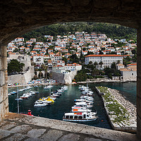 Buy canvas prints of Boats in Dubrovnik's old harbour by Jason Wells