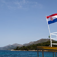 Buy canvas prints of Croatian flag on a tourist boat by Jason Wells