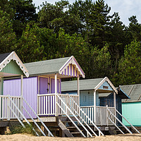 Buy canvas prints of Colourful beach huts by Jason Wells