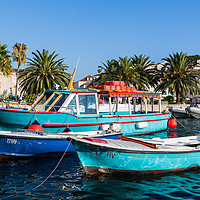 Buy canvas prints of Colourful boats in Hvar Town by Jason Wells