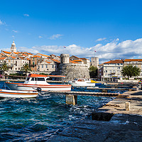 Buy canvas prints of Boats bob on the choppy waters by Korcula old town by Jason Wells