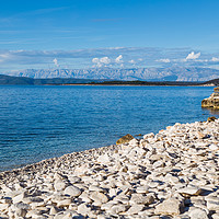 Buy canvas prints of Overlooking the pebbles of Vaja Bay by Jason Wells