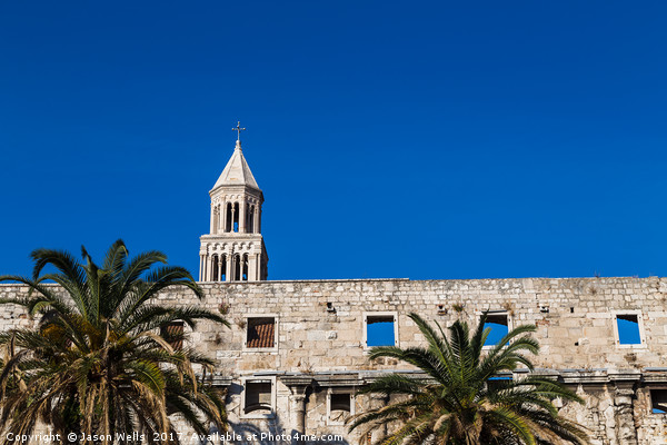 Diocletian's Palace standing above the palm trees  Picture Board by Jason Wells