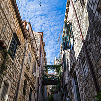 Buy canvas prints of Beautiful narrow street in Dubrovnik by Jason Wells