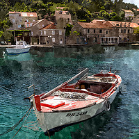 Buy canvas prints of Small boat moored in Sudjuradi by Jason Wells