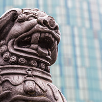 Buy canvas prints of Lion statue against a modern background by Jason Wells