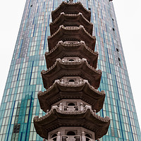 Buy canvas prints of Chinese pagoda in front of a modern skyscraper by Jason Wells