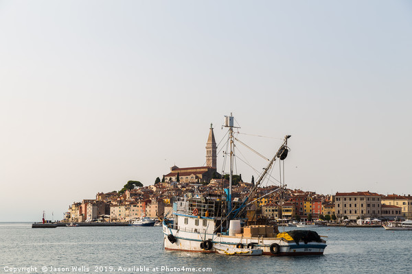 Fishing boat in Rovinj harbour Picture Board by Jason Wells