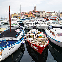 Buy canvas prints of Boats bobbing in Rovinj harbour by Jason Wells