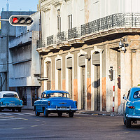 Buy canvas prints of Trio of blue classical cars by Jason Wells