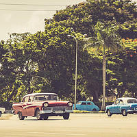 Buy canvas prints of Old American cars pass Revolution Square by Jason Wells