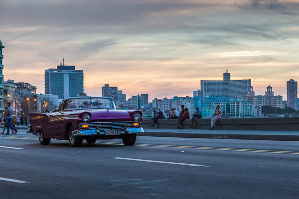 Tourists in a vintage car on the Malecon Picture Board by Jason Wells