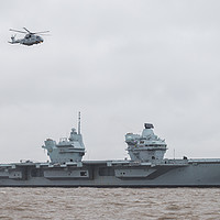 Buy canvas prints of Merlin helicopter overflies HMS Prince of Wales by Jason Wells
