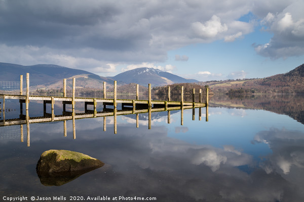 Wooden jetty lit up on Derwent Water Picture Board by Jason Wells