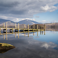 Buy canvas prints of Wooden jetty lit up on Derwent Water by Jason Wells
