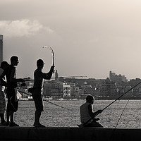 Buy canvas prints of Men fishing from the Malecon wall at dusk by Jason Wells