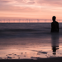 Buy canvas prints of Iron Man watches out to sea at dusk by Jason Wells