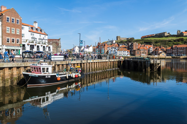 Fishing boat in Whitby harbour Picture Board by Jason Wells