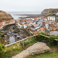 Buy canvas prints of Bench looking down on Staithes by Jason Wells