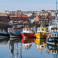 Buy canvas prints of Colourful fishing boats in Scarborough harbour by Jason Wells