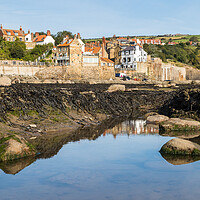 Buy canvas prints of Rockpools in front of Robin Hoods Bay by Jason Wells