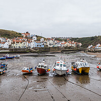 Buy canvas prints of Fishing boats in Staithes harbour by Jason Wells