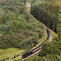 Buy canvas prints of Steam train navigating a valley by Jason Wells