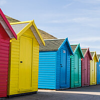 Buy canvas prints of Pretty beach huts in Whitby by Jason Wells