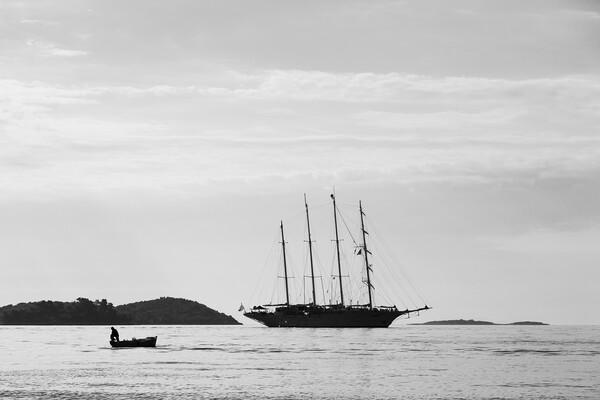 Silhouette of contrasting boats on the Peljesac Ch Picture Board by Jason Wells
