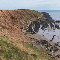 Buy canvas prints of Filey Brigg cliffs and rock pools by Jason Wells