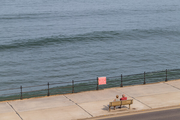 Looking down on a couple on the Scarborough promenade Picture Board by Jason Wells