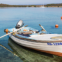Buy canvas prints of Fishing boat in the shallow waters by Jason Wells