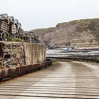 Buy canvas prints of Slipway down to the shoreline at Staithes by Jason Wells