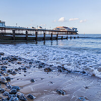 Buy canvas prints of Waves lap the beach at Cromer by Jason Wells