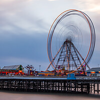 Buy canvas prints of Ferris wheel spinning on Blackpool's Central Pier by Jason Wells