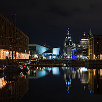 Buy canvas prints of Three Graces and the festive lights reflect in the Albert Dock by Jason Wells