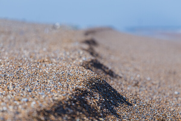 Shingle on the beach at Cley next the Sea Framed Mounted Print by Jason Wells