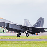 Buy canvas prints of F-22A Raptor taking off by Jason Wells