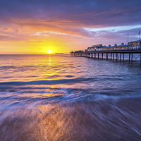 Buy canvas prints of Paignton Pier at Sunrise by John Fowler