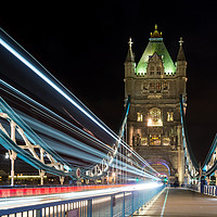 Buy canvas prints of Tower Bridge Light Trails by John Fowler