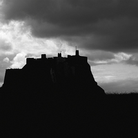Buy canvas prints of  Lindifarne Castle at Holy Island in silhouette. by Ivan Kovacs