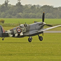 Buy canvas prints of Spitfire touchdown at Duxford by Alex Haines