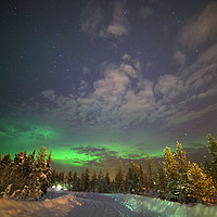 Buy canvas prints of The Aurora Glows in the distance  by Teresa Cooper