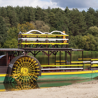 Buy canvas prints of Sternwheeler moored on river strand attraction  by Arletta Cwalina