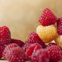 Buy canvas prints of bright red and golden raspberry fruits by Arletta Cwalina