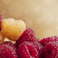 Buy canvas prints of raspberry fruits in pile with circles bokeh  by Arletta Cwalina