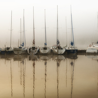 Buy canvas prints of  Fog and moored boats by Arletta Cwalina