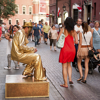 Buy canvas prints of Levitating golden dressed man by Arletta Cwalina