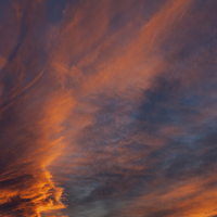 Buy canvas prints of Brooding orange sunset clouds by Arletta Cwalina